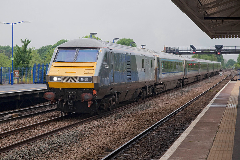 82301, CH 07.05 Kidderminster-London Marylebone (1H22, 2L), Princes-Risborough station 
 DVT 82301 leads the Chiltern 'MainLine' 1H22 07.05 Kidderminster to Marylebone as it passes at speed through Princes Risborough. These 'premium' train services have proved popular and just go to show how much better loco. hauled services are compared to a unit on a long journey such as this. It also proves the enduring design of the Mk.III stock that, despite its refurbishment, is still some forty years old. 
 Keywords: 82301 1H22 Princes-Risborough station