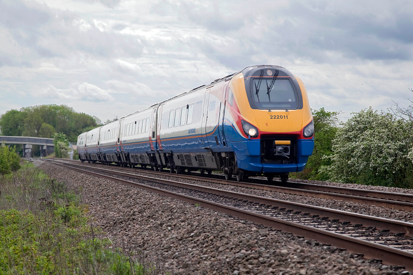 222011, EM 09.58 London St. Pancras-Sheffield (1F21, 3E), Souldrop SP983611 
 222011 is seen from an angle reminiscent of my early railway pictures where I adopted this viewpoint on many occasions! With tricky lighting that has needed a fair bit of 'Photoshoping' the 09.58 St. Pancras to Sheffield passes a foot crossing just outside Souldrop in Bedfordshire. 
 Keywords: 222011 1F21 Souldrop SP983611