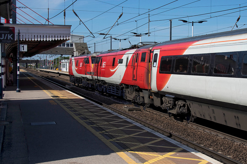 91126 & 91122, GR 12.00 Edinburgh-London King`s Cross (1E14, 8L), Newark Northgate station 
 I have never witnessed the relatively rare event of a class 91 running blunt end first on the ECML. Whilst 91122 is running with its blunt end exposed it is at the back of this train with 91126 'Darlington Hippodrome' tucked in with its pantograph down. I am not sure what event caused this unusual occurrence but the 12.00 Edinburgh to King's Cross was running to-time and had done so since it left Waverley at lunchtime. It is seen here leaving Newark Northgate station. 
 Keywords: 91126 91122 12.00 Edinburgh-London King`s Cross 1E14 Newark Northgate station