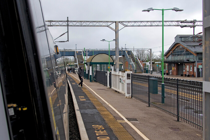 10.10 Northampton-London Euston (2N06, 1E), Wolverton station platform 2 
 I don't usually take photographs from train doors when they have arrived at a station! However, in this case I made an exception as this is the only time (as far as I am aware) that a train that I am travelling on has stopped at Wolverton station's platform two (the up fast platform). Usually, the platform is not used being fenced off and secured by locked sliding gates as seen to the right. However, due to engineering works on the slow lines south from Hanslope Junction, all trains were routed on the fast lines. Some passengers are seen having alighted from the 10.10 Northampton to Euston train and will need to pass through the gates before using the footbridge to reach the exit. 
 Keywords: 10.10 Northampton-London Euston 2N06 Wolverton station platform 2