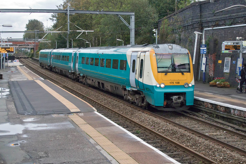 175108, AW 17.15 Manchester Piccadilly-Chester (1D40, 2L), Eccles station 
 Still in its former operator's livery but devoid of any branding, 175108 passes through Eccles station with the 17.15 Manchester Piccadilly to Chester service. This station is a noisy location being directly adjacent to the M602 motorway that carries a lot of traffic in and out to the west of Manchester. 
 Keywords: 175108 17.15 Manchester Piccadilly-Chester 1D40 Eccles station