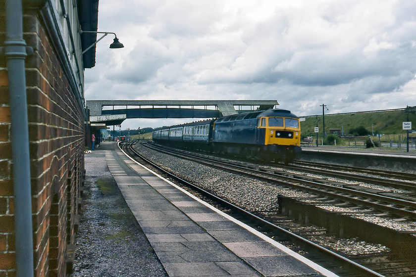 47225, 23.40 Glasgow-Plymouth (1V57), Tiverton Junction station 
 47225 takes the centre road through Tiverton Junction station leading, what I believe to be, the 1V57 23.40 Glasgow Central to Plymouth. Back in the pre-internet days establishing workings was down to the use of the 'bible' or the huge national timetable that was carried everywhere, viewing the stock and the locomotive and using a bit of common sense but lateness of a train would compromise the accuracy of the identification. Notice the front of Tiverton Junction signal box dominating the left-hand side of the photograph. 47225 is still in use today but now rebuilt and renumbered as 57307 'Lady Penelope', seen recently .......... https://www.ontheupfast.com/p/21936chg/29301193204/x57307-unidentified-working-0z99 
 Keywords: 47225 23.40 Glasgow-Plymouth 1V57 Tiverton Junction station