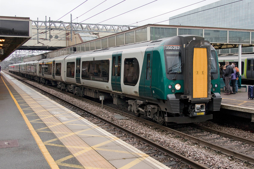 350257 & 350253, LN 07.35 Liverpool Lime Street & 08.01 Crewe-London Euston (1G10 & 1W08, 2L), Milton Keynes Central station 
 London Northwestern have persisted with their seemingly obsessive strategy of joining and splitting services even after the new timetable was recently introduced. It has not been a great success and with the Liverpool services being a particular problem not meeting their other service at Birmingham New Street. One of the such services that seems to have worked is seen here at Milton Keynes station. The 07.35 from Lime Street and the 08.01 from Crewe arrived at Euston just four minutes adrift. 
 Keywords: 350257 350253 07.35 Liverpool Lime Street 08.01 Crewe-London Euston 1G10 1W08 Milton Keynes Central station Desiro London Northwestern