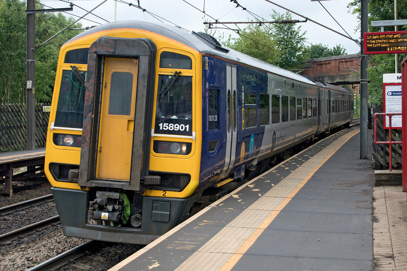 158901, NT 10.40 Knottingley-Leeds (2A08, RT), Outwood station 
 158901 speeds through Outwood station with the 2A08 10.40 Knottingley to Leeds Northern service. The last time that I saw this unit it wore a different livery but it was an equally dull and chilly day, see.... https://www.ontheupfast.com/p/21936chg/26273766404/x158901-16-04-bridlington-hull-1g19 
 Keywords: 158901 10.40 Knottingley-Leeds 2A08 Outwood station Northern