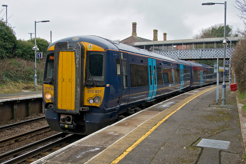 375827, SE 11.45 London Charing Cross-Hastings (1H32, RT), West St. Leonards 
 Hastings, a town of under 100 000 people is blessed with no more than four stations! West St. Leonards is the (unsurprisingly!) most westerly of them at the point where the London line diverges from the coast route to Brighton. 375827 passes through the station with the 11.45 Charing Cross to Hastings service. 
 Keywords: 375827 11.45 London Charing Cross-Hastings 1H32 West St. Leonards station