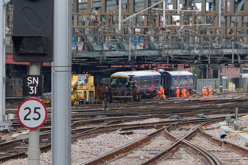 165124, undergoing re-railing following ECS derailment @18.00, 16.06.16, London Paddington station 
 The front car of 165124 looks in a pretty bad way as it sits forlornly against an electrification mast that it hit at about 25mph following it overrunning a signal on the entry to Paddington station. Luckily, the train was empty running in from Old Oak Common and nobody, including the driver, were injured. The RAIB report made a number of recommendations relating to driver eating arrangements and to route knowledge. The 165 was repaired at Derby and back in service in its new GWR green livery. 
 Keywords: 165124 re-railing derailment 18.00 16.06.16 London Paddington station