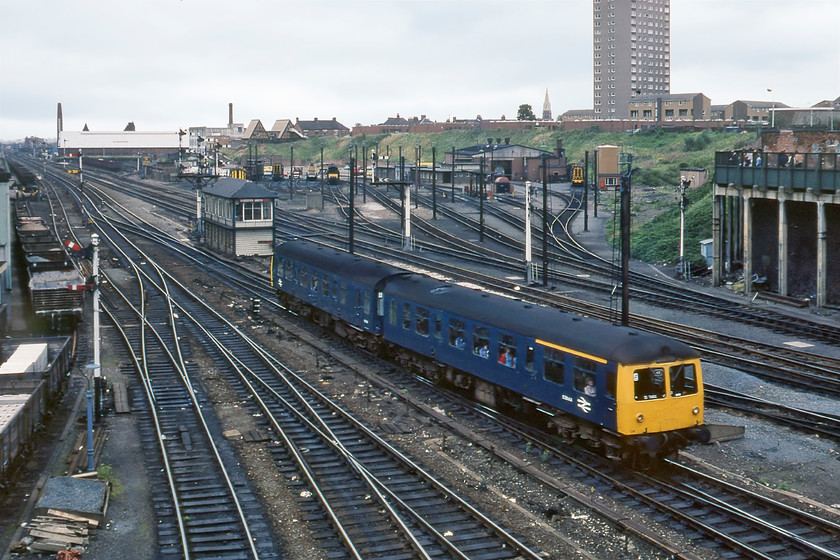 M56144 & M51291, 12.05 Peterborough-Leicester, Leicester North 
 The 12.05 Peterborough to Leicester service approaches it destination being worked by a Class 105 Cravens DMU with Driving Trailer Composite Lavatory (DTCL) E56144 leading a Motor Brake Second (MBS) number M51291 at the rear. The leading car had just another two years in service whilst the powered car lasted on to January 1985 with both withdrawn at their home depot of Norwich. Behind the DMU is Leicester North signal box a Midland Type 4C that opened in 1911. Whilst many ignored DMUs at this time concentrating on saving their valuable film for more exotic machines I always tried to capture them. Looking back some forty years later, I am so glad that I made the effort; for the record, I really like this photograph! 
 Keywords: M56144 M51291 12.05 Peterborough-Leicester Leicester North Class 105 Cravens Driving Trailer Composite Lavatory DTCL E56144