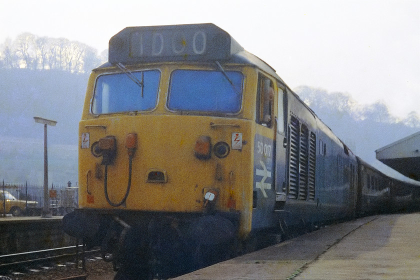 50 017, unidentified up working, Bath Spa station 
 The driver looks on, no doubt wondering why this young lad is taking a picture of his fine engine looking up and directly into the afternoon sun? 50017 in pre-named and pre-overhauled condition sits at the head of a Paddington Express at Bath Spa. By early 1976, the 50s were in squadron service on the GWML having largely ousted the Westerns and just a few months prior to the introduction of the HSTs. However, they were worn out from their use on the WCML and the Western Region maintenance staff had not really got to grips with looking after them so their reliability at this time was pretty awful. 
 Keywords: 50 017 Bath Spa station