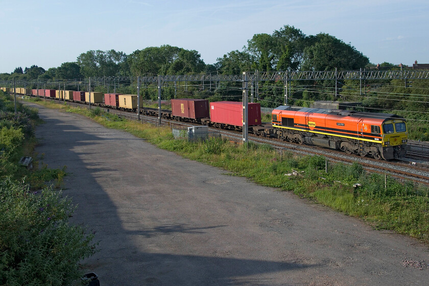 66509, 02.57 Felixstowe North-Garston (4M45, 45E), site of Roade station 
 Just four minutes after the 4M18 had passed the 4M45 02.57 Felixstowe North to Garston passes Roade hot on its heels led by Freightliner's 66509 'Josiah's Wish'. Note that this service must overtake 4M18 at some time in its journey as it leaves Felixstowe twenty minutes before it! 
 Keywords: 66509 02.57 Felixstowe North-Garston 4M45 site of Roade station Freightliner Josiah's Wish