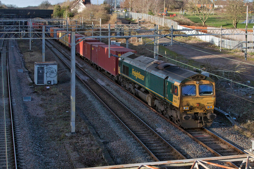 66507, 12.16 Lawley Street-London Gateway (4L46, 2E), site of Roade station 
 The 12.16 Lawley Sreet to London Gateway Freightliner emerges into the late afternoon sunshine from the relative darkness of Roade cutting led by 66507. This Freightliner Class 66 is not one of my most commonly photographed with me having just two other images of it recorded. 
 Keywords: 66507 12.16 Lawley Street-London Gateway 4L46 site of Roade station Freightliner