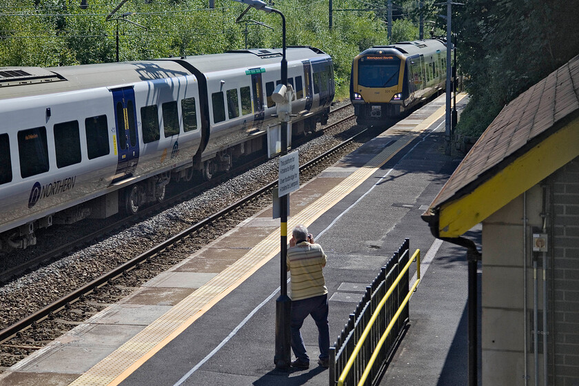 Andy, 331024, NT 15.53 Wigan North Western-Liverpool Lime Street (2C21, 1E) & 331107, NT 15.39 Liverpool Lime Street-Blackpool North (1N89, RT), Bryn station 
 Andy captures his image of 331107 as it passes through Bryn station at speed working the 15.39 Liverpool to Blackpool North service. Meanwhile, 331024 waits at the other platform working the 15.53 Wigan North Western to Liverpool train. I feel that a station named Bryn would be more suited to somewhere in South Wales than just west of Wigan! 
 Keywords: Andy 331024 15.53 Wigan North Western-Liverpool Lime Street 2C21 331107 15.39 Liverpool Lime Street-Blackpool North 1N89 Bryn station Northern