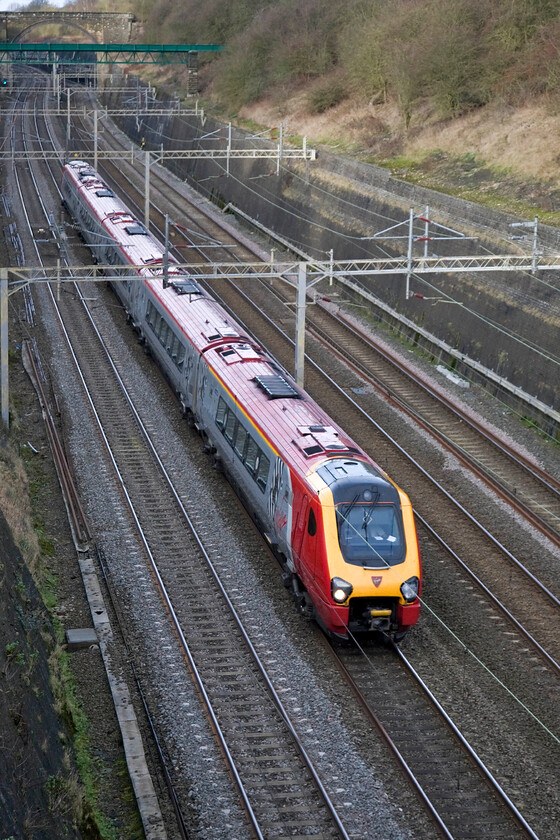 Class 221, VT 11.28 Chester-London Euston, (1A19), Roade cutting 
 An unidentified Virgin Voyager roars its way through Roade cutting working the Sunday's 11.28 Chester to Euston 1A19 service. This particular Class 221 looks very smart and as if it has been in receipt of some attention in the depot or even some sort of re-paint? 
 Keywords: Class 221 11.28 Chester-London Euston 1A19 Roade cutting