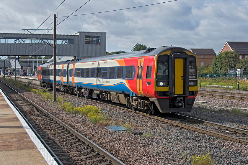 158889, EM 07.55 Norwich-Liverpool Lime Street (1R64, 2L), Peterborough station 
 EMR's 'Regional' branded 158889 leaves Peterborough working the 07.55 Norwich to Liverpool Lime Street service. These units, whilst still serviceable and competent are over thirty years old now and I suspect that they are ripe for replacement by more modern units as and when the become available. 
 Keywords: 158889 07.55 Norwich-Liverpool Lime Street 1R64 Peterborough station EMR