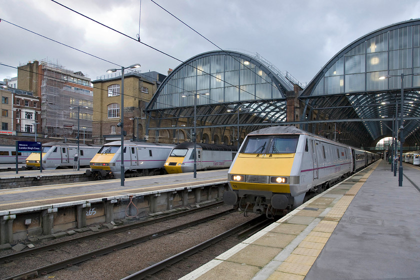 91132, 91113, 43307 & 91102, various workings, London King's Cross station 
 A veritable grey feast of trains lines up at King's Cross. From the left is 91132, with 91113 next to 43307. Nearest the camera is 91102 'City of York' that will soon head north with an East Coast service. 
 Keywords: 91132 91113 43307 91102 various workings London King's Cross station East Coast City of York