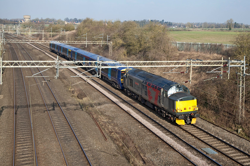 37608 & 375826, 04.42 Chaddesden-Ramsgate EMUD (5Q58), Victoria Bridge. 
 Europhoenix's 37608 'Andromeda' is seen passing Victoria Bridge near to Roade on the WCML hauling Electrostar 378826 back to Ramsagte after overhaul at Derby. This stock move usually travelled on the Midland Mainline but was often diverted as on this morning. 
 Keywords: 37608 Andromeda Europhoenix 375826 5Q58 Victoria Bridge.