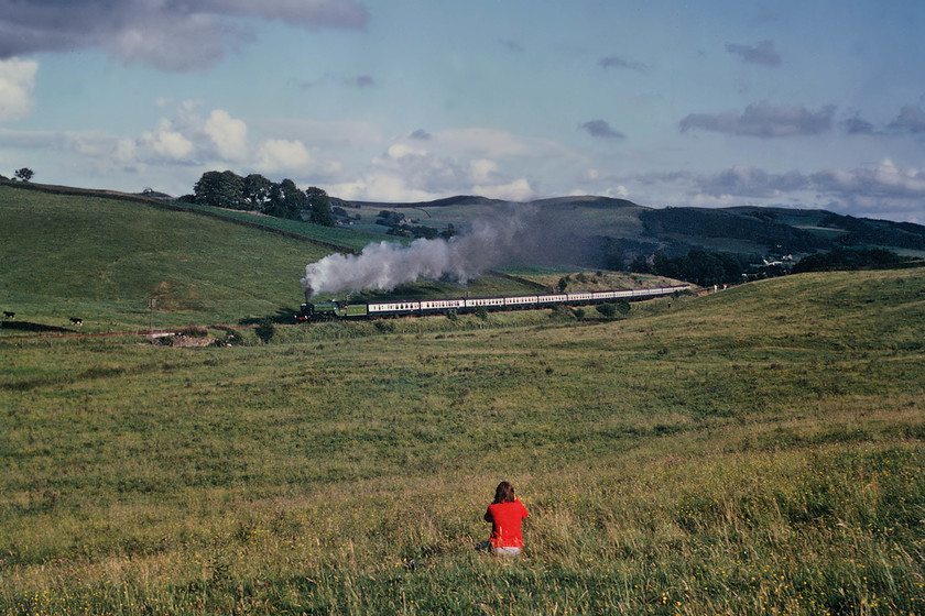 4472 & me, return leg of The North Yorkshireman, Skipton-Carnforth, Giggleswick SD793638 
 4472 'Flying Scotsman' climbs away from Giggleswick with the return North Yorkshireman railtour from Skipton to Carnforth. The photograph was taken by my companion Graham and yes, that is a fifteen-year-old me in the foreground taking my photograph..... https://www.ontheupfast.com/v/photos/21936chg/26751474404/x0012-4472-return-leg-north-yorkshireman 
 Keywords: 4472 The North Yorkshireman Skipton-Carnforth Giggleswick SD793638