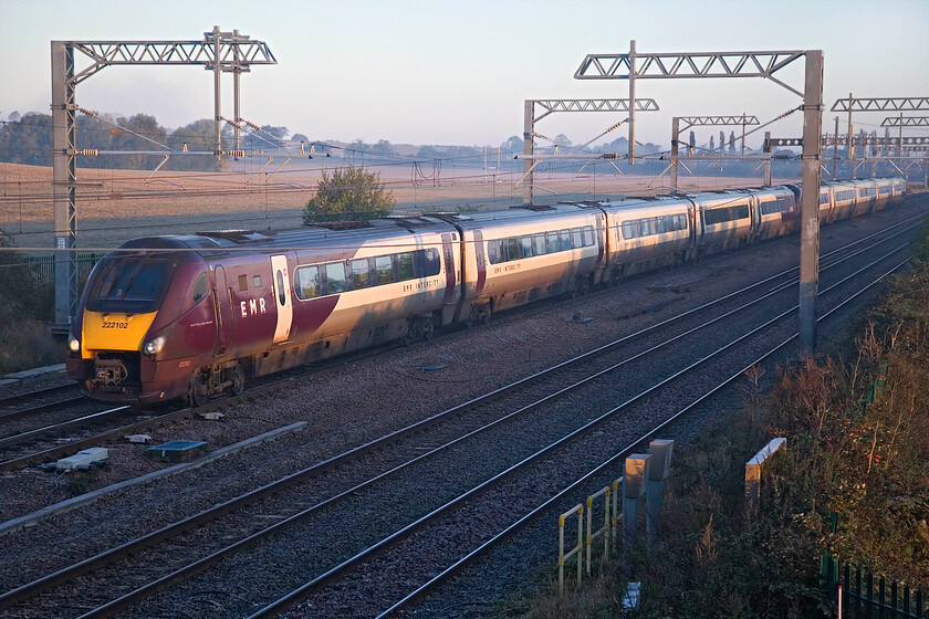 222102 & 222010, EM 06.49 Nottingham-London St. Pancras (1B13, 2L), Harrowden Junction 
 The rising sun is just high enough to illuminate the flank of the train as it passes Harrowden Junction between Kettering and Wellingborough. 222102 and 222010 are working the 1B13 06.49 Nottingham to St. Pancras service. It won't be long now until the new Class 810 Aurora sets will be in service on this route with testing currently underway that will see the trusty Meridians heading off to new tracks. 
 Keywords: 222102 222010 06.49 Nottingham-London St. Pancras 1B13 Harrowden Junction EMR Meridian