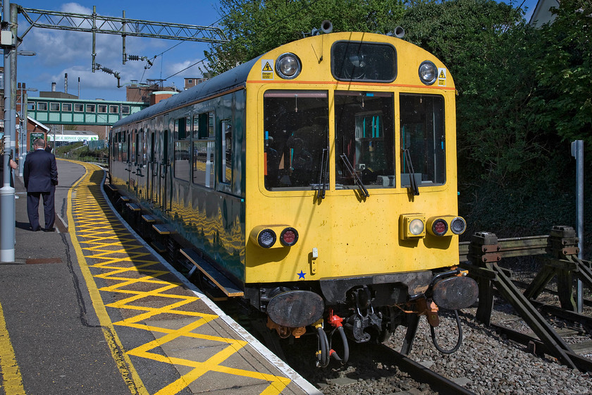 975025 'Caroline', 07.25 Willesden-Willesden (via Cambridge & Ipswich), Witham station 
 975025 'Caroline' stands at the head of the 07.25 Willesden return tour at Witham station. I am not sure as the special passenger it was carrying were but they all had suits on there seemed to a fine spread laid on inside along with plenty bottle of wine on the tables! 97205 has a very interesting history. It was built in 1958 by Eastleigh Works as a trailer restaurant buffet car (TRB) S60755 as part of Class 203 diesel-electric multiple-unit 1036. The 203 were built with slightly narrower bodies to clear the tight tunnels on the Hastings line, its slightly unusual proportions are still clear today in this photograph. 
 Keywords: 975025 Caroline 07.25 Willesden-Willesden via Cambridge & Ipswich Witham station