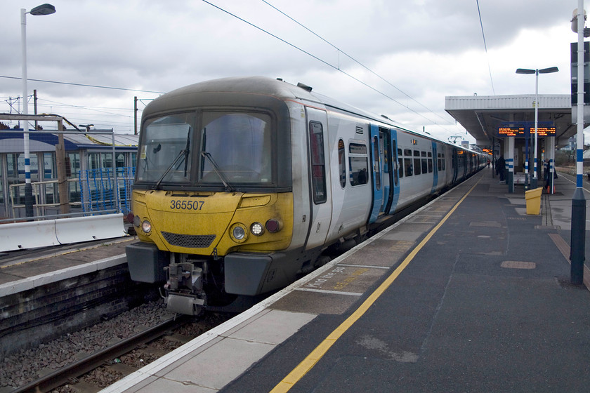 365307, GN 11.52 London-King`s Cross-Cambridge (1C52, 4L), Finsbury Park station 
 Having travelled out the short distance from King's Cross I alighted from 365307 here at Finsbury Park station. It was forming the 11.52 King's Cross to Cambridge (1C52) service. These 'Networker' units were introduced in the early 1990s and have been a successful class. The had a mid-life makeover when extensive work was undertaken including a re-designed front and that created their 'smiler' look. 
 Keywords: 365307 1C52 Finsbury Park station