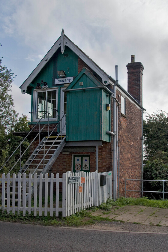 Rauceby signal box (GN, 1880) 
 According to The Signal Box website (https://signalbox.org/section-c/alterations-2021/) plans to abolish Ruceby and Ancaster signal boxes and to automate the remaining manual level crossing have 'not progressed' with 'no immediate plans to abolish these boxes now'. So until the plans are resurrected we can enjoy the delights of some mechanical absolute block signalling and the delightful scene of a signalman descending the box steps to close and open the wooden crossing gates. The superb Great Northern box dating from 1880 is always a tricky one to get a decent photograph of hence this reverse image! 
 Keywords: Rauceby signal box