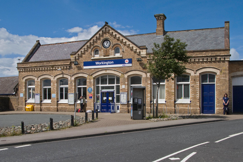 Frontage, Workington station 
 Built out of yellow Crewe bricks and in a style typical of the London and North Western Railway the frontage of Workington station is seen basking in some warm summer sunshine. This is the second station in Workington opening in 1866 replacing the first one built by the Whitehaven Junction Railway that was destroyed by a disastrous accident and subsequent fire in 1854. 
 Keywords: Frontage Workington station