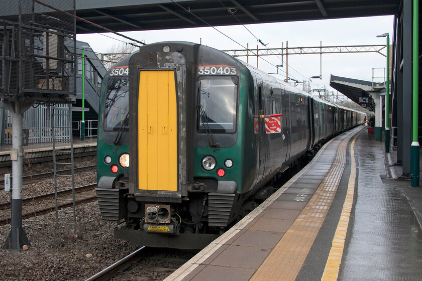 350403, LN 08.36 Birmingham New Street-London Euston (1Y24, RT), Northampton station 
 Most through London Northwestern services from Birmingham to Euston do not so much as pause at Northampton (about halfway between the two cities) but have a layover! This must be very frustrating for passengers making the thorough journey sitting for twenty minutes or so whilst the train is watered and cleaned. Is this really acceptable on the modern railway and is the extended stop there to suit London Northwestern,? Our train south to London, the 08.36 from New Street, complete with its 'do not move' sign, waits at Northampton station. At least we arrived in the capital bang on time! 
 Keywords: 350403 08.36 Birmingham New Street-London Euston 1Y24 Northampton station London Northwestern Desiro