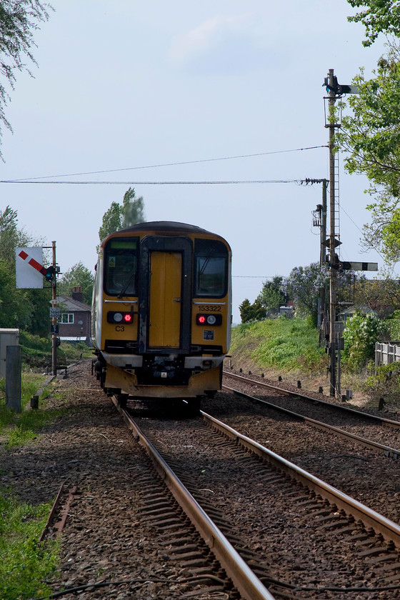 153322, LE 14.57 Lowestoft-Norwich (2J812, 1L), Cantley station 
 At the western end of Cantley station there are obviously sighting issues for both up and down trains. The up home has a sighting board behind it and the extremely tall C21 (outer home) has a pair of co-acting arms, now a rare survivor on the network. These delightful pieces of Victoria infrastructure should be replaced with modern signalling by 2020 if NR's plans come to fruition; we'll see! The driver of 155322, forming the 15.57 Lowestoft to Norwich, has just gone straight through the station and is passing the up home, next stop Brundall. 
 Keywords: 153322 2J812 Cantley station