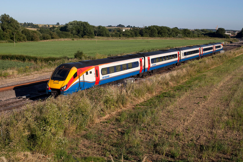 222008, EM 18.05 London St. Pancras-Lincoln (1D64, 1E), Harrowden Junction 
 I like the East Midlands' livery, it looks equally smart on these class 222 Meridians and on the HSTs. East Midlands also makes an effort to keep its trains looking clean and smart. Here, in the lovely soft evening light, 222008 'Derby Etches Park' crosses Harrowden Junction north of Wellingborough, working the daily 18.05 London St. Pancras to Lincoln Central. I find it strange that the station at Lincoln is still persistently referred to as 'Central' by all the railway TOCs and Network Rail. There is only one station in Lincoln since St. Marks closed in 1985! 
 Keywords: 222008 1D64 Harrowden Junction