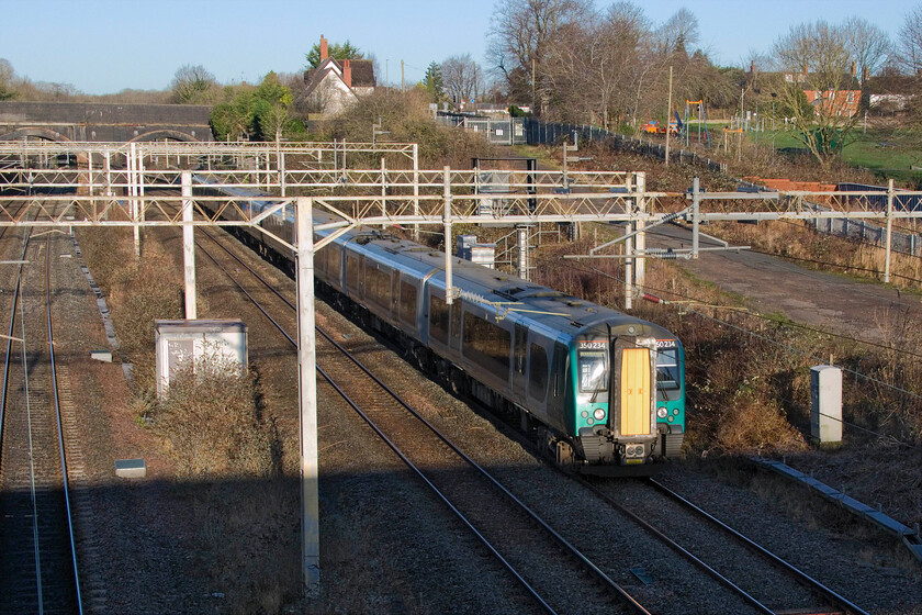 350234, LN 08.36 Birmingham New Street-London Euston (1Y24, 3L), site of Roade station 
 Soon to go off-lease 350234 passes Roade working the 08.36 Birmingham New Street to Euston service. The low winter sunshine has created a significant problem at this location in the form of a deep shadow created by the footbridge on which I am standing that is not an issue at other times of the year, see.... https://www.ontheupfast.com/p/21936chg/30058144583/x150137-15-36-newton-heath-bletchley 
 Keywords: 350234 08.36 Birmingham New Street-London Euston 1Y24 site of Roade station London Northwestern Desiro