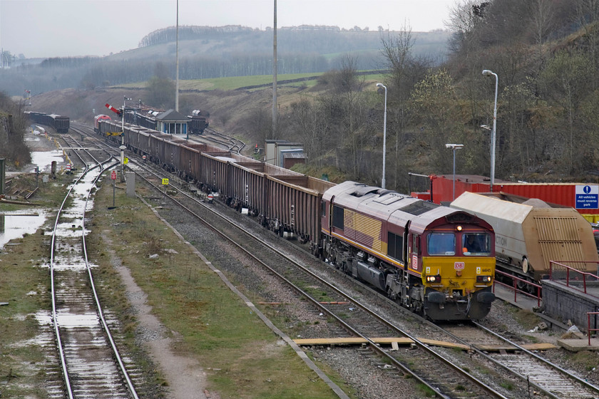 66145 & 60044, 09.57 Bletchley-Peak Forest, Peak Forest South 
 66044, at the rear of the train in the distance, will have worked it all the way from Bletchley in Buckinghamshire earlier in the day leaving at 09.57. Having arrived at Peak Forest, 66145 has been attached and is about to drag the train back into the exchange sidings behind me for it to be loaded again with aggregates. After such a smashing start to the day, it has clouded up here in the Peak District and is now a very grey afternoon. 
 Keywords: 66145 60044, 09.57 Bletchley-Peak Forest, Peak Forest South