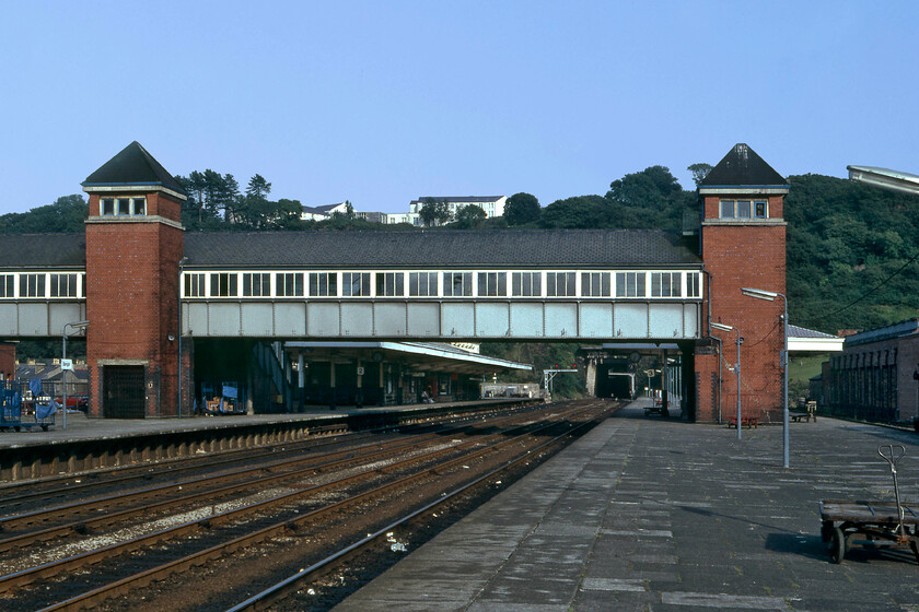 Bangor station 
 Looking eastwards along the length of Bangor station reveals a wide-open layout with the platforms linked by a grand enclosed footbridge with some impressive lift towers. I replicated this 1981 photograph when I visited again in 2016, see..... https://www.ontheupfast.com/p/21936chg/25632548604/bangor-station 
 Keywords: Bangor station