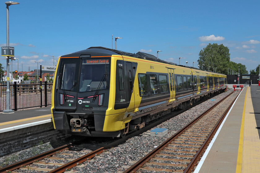 777146, ME 14.26 Headbolt Lane-Liverpool Central (2F34, 1L), Headbolt Lane station 
 A new station for both Andy and I, Headbolt Lane opened in its present state on 05.10.23. Juat beyond the buffer stops is the Northern portion of the station with services running to Manchester via Wigan. The arrangement is similar to that at Ormskirk. With the introduction of the battery-powered Class 777/1s services could then operate from Liverpool direct as far as Kirkby where the station is located. One of the seven battery-powered Class 777s waits in the sunshine at Headbolt Lane that will work the 14.26 service to Liverpool central. Andy and I took this train back to Sandhills. 
 Keywords: 777146 14.26 Headbolt Lane-Liverpool Central 2F34 Headbolt Lane station