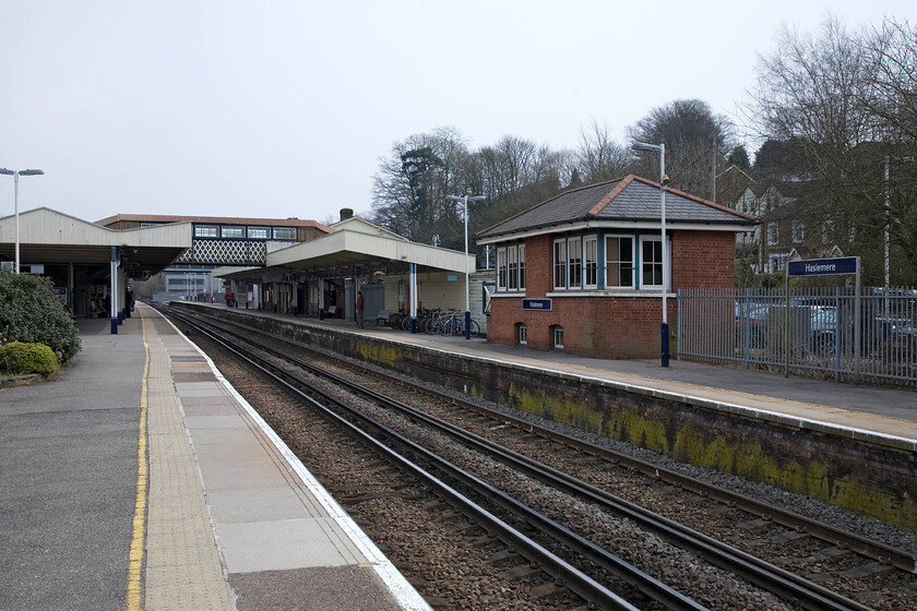 Haselmere station & signal box (LSW, 1895) 
 Located nearly forty-three miles from London Victoria Haslemere station remains a busy commuter start and finish point for nearly one point five million passengers annually. The station was originally opened in 1859 but was expanded and rebuilt when the electrification arrived in 1938. Today, the station enjoys a regular and fast service to either London or Portsmouth. Notice the 1895 signal box located on the platform as was a fairly common practice for the London and South Western railway. 
 Keywords: Haselmere station signal box LSW