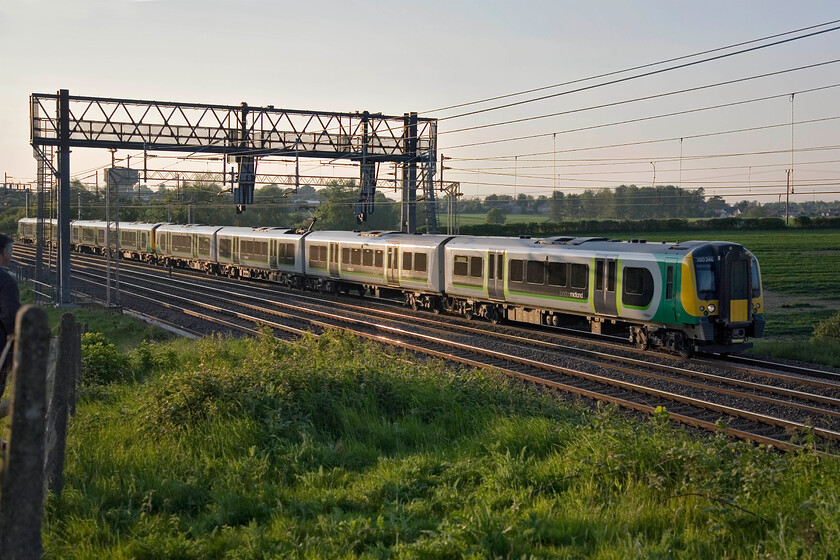 350246, unidentified up service, Roade Hill 
 Rather side-lit but in lovely soft evening sunshine 350246 heads south near the village of Roade with an unidentified up service. On a Saturday evening, it ought to have been easy to identify this working but an emergency timetable was operating due to the closure of the Northampton line at Long Buckby. This meant all locals were starting from and terminating at Northampton with any through services taking the Weedon route that made for an interesting next train...... 
 Keywords: 350246 unidentified up service Roade Hill London Midland desiro