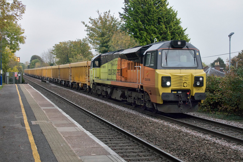 70813, 11.56 Westbury TC-Cliffe Hill Stud Farm (6M40), Warwick station 
 Colas liveried 70813 shatters the peace and quiet at Warwick station on an autumn afternnon as it passes with the 11.56 Westbury to Cliffe Hill empty stone train. This will be going to the quarry deep in the Leicestershire countryside near to Coalville to pick up ballast. 
 Keywords: 70813 11.56 Westbury TC-Cliffe Hill Stud Farm 6M40 Warwick station