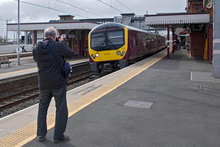 360110, EM 08.47 London St. Pancras-Corby (1Y13, RT), Wellingborough station 
 Andy secures his photograph of our first train of the day that would take us just eight miles to Kettering. 360110 arrives at Wellingborough with 360107 at the rear working the 08.47 St. Pancras to Corby East Midlands Railway service. 
 Keywords: 360110 08.47 London St. Pancras-Corby 1Y13 Wellingborough station EMR EMT Desiro