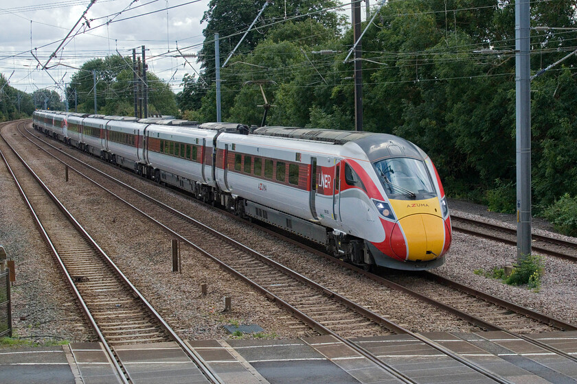 800202 & 800210, GR 10.05 London King's Cross-Leeds (1D09, RT), Tallington 
 For a strike day, I was surprised at the number of service trains running whilst I was at Tallington crossing waiting for a far more interesting train. One such strike-breaking service was the 1D09 10.05 King's Cross to Leeds service worked by 800202 and 800210. For once I was actually grateful for it being an essentially cloudy morning as this photograph would have been into the sun had it been a clear day. The eastern side of the footbridge at Tallington that was installed when the line was electrified offers much better photographic opportunities. 
 Keywords: 800202 800210 10.05 London King's Cross-Leeds 1D09 Tallington LNER Azuma