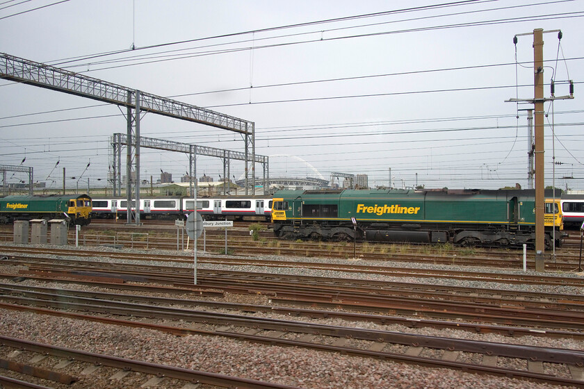 66544, 321328 & 66564, stabled, Wembley Yard 
 By the time we passed Wembley Yard the bright and clear blue skies of earlier in the day further south had become somewhat overcast but that did not belie that it was still extremely hot with very high levels of humidity. Seen from a Class 350 passing Wembley Yard at speed sees 66544 and 66564. stabled awaiting their next turn of duty. Between them stored and stabled former Greater Anglia's 321328 is seen. 
 Keywords: 66544 321328 66564 stabled Wembley Yard