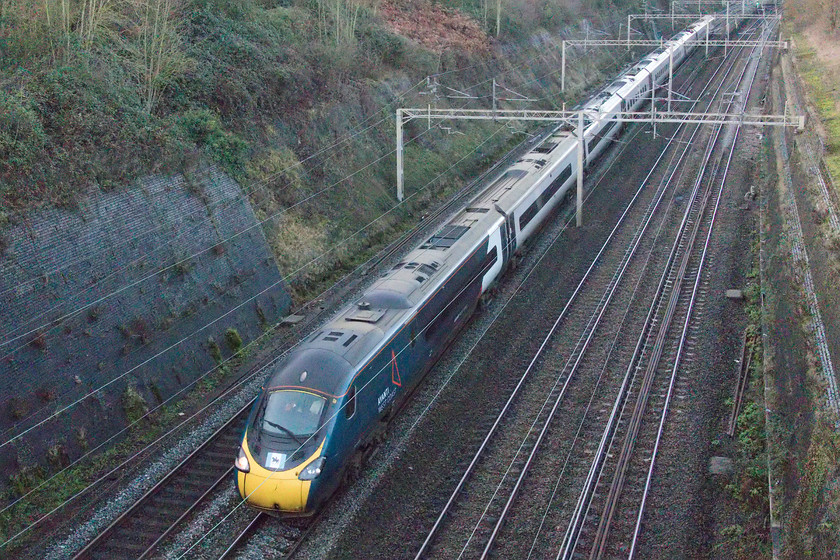 390036, VT 14.30 BNS-London Euston (1B26, RT), Roade cutting 
 I am pleased to see that whilst 390036 'City of Coventry' has been repainted into its Avanti West Coast livery it has not lost its unique identifier attached to both nose cones. The image of the city's Lady Godiva on her horse is shown between two flashes of sky blue the colour associated with the city since it was adopted by Coventry City Football Club under the then successful manager Jimmy Hill in the 1960s. The Pendolino is working the afternoon 1B26 14.30 Birmingham to Euston service through Roade cutting that will have stopped at its namesake's station some thirty minutes prior to this photograph being taken. 
 Keywords: 390036 14.30 BNS-London Euston 1B26 Roade cutting