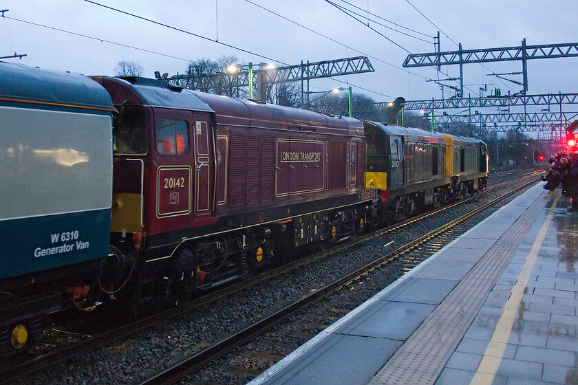 20142, 20007 & 20205, 17.28 Watford Junction-Wembley Yard ECS (5Z57, RT), Watford Junction station 
 With three thousand horsepower available, the 17.28 Watford Junction to Wembley Yard ECS run should have an easy and straightforward trip through the North London suburbs worked by 20142 'Sir John Betjamin', 20007 and 20205. Notice the throng of enthusiasts gathered on the platform end to witness the lively departure, many of whom had travelled on the train from Kidderminster. The following day, the locomotives and stock would work The Shakespearean Sonnet charter from Paddington. 
 Keywords: Sir John Betjamin 20142 20007 20205 17.28 Watford Junction-Wembley Yard ECS 5Z57 Watford Junction station Chopper