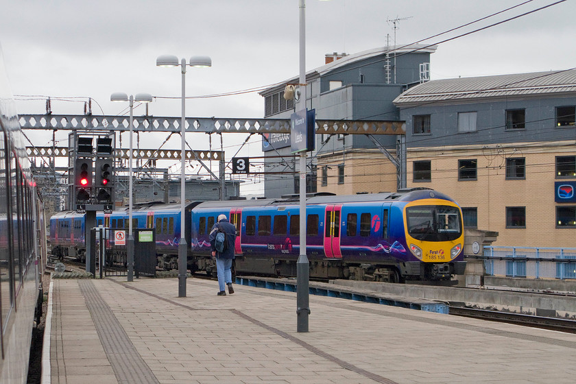 185136, TP 14.22 Liverpool Lime Street-Scarborough (1E88), Leeds station 
 185136 leaves Leeds station forming the 14,22 Liverpool to Scarborough service. The photograph is taken from our diverted hst as it enters the station. Notice th Tvaleodge hotel behind the station, I am trying to persuade my wife for us to stay in this when we visit Leeds and better still for us to bag a room at the back, at the moment, she's having none of it! 
 Keywords: 185136 14.22 Liverpool Lime Street-Scarborough 1E88 Leeds station TransPennine Express Desiro