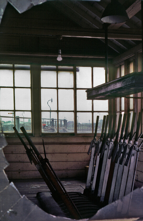 Former New Holland Pier signal box 
 Since the removal of the short siding and with the second line being taken out of use on New Holland Pier the signal box became redundant. Control on and off the pier was handed to New Holland Town box at the landward end of the pier. As can be seen through the broken window pane the lever frame is still extant but the levers themselves have lost a little of their shine! Remarkably, this box still stands on the pier but I am not sure if the frame remains. 
 Keywords: Former New Holland Pier signal box