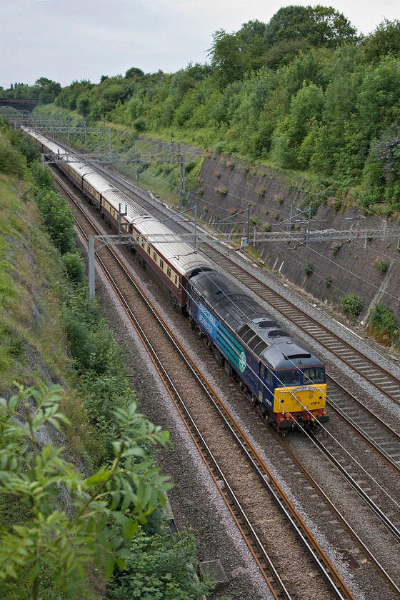 47818, 08.23 London Euston-Milton Keynes via Northampton (1Z91), Roade cutting 
 DRS' 47818 leads the 1Z91 08.23 Euston to Milton Keynes Northern Belle charter through Roade cutting. The train has already passed Milton Keynes once but the relatively short journey from London did not give passengers enough time to quaff their champaign and eat their grand breakfasts so the train is making a return run to Northampton. 
 Keywords: 47818 08.23 London Euston-Milton Keynes via Northampton 1Z91 Roade cutting DRS Direct Rail Services The Northern Belle