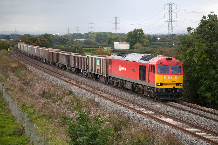 60039, 13.30 Appleford-Whatley (6C48), Berkley ST808497 
 60039 'Dove Holes' brings the 13.30 Appleford to Whatley Quarry stone empties train past Berkley just east of Frome. As can be seen, I am in for a soaking as the squall in the background heads in from the south east. Indeed, within about five minutes, it was absolutely chucking it down with rain. 
 Keywords: 60039 13.30 Appleford-Whatley 6C48 Berkley ST808497