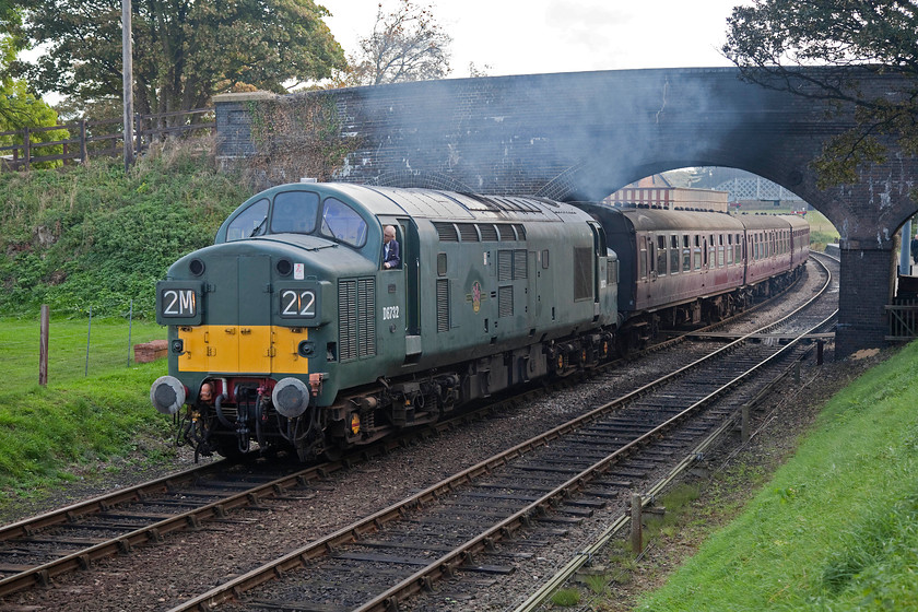 D6732, 09.45 Sheringham-Holt, Weybourne 
 D6732 (ex 37032) storms out of Weybourne station working the 09.45 Sheringham to Holt. I saw this class 37 on this line when it was fresh out of overhaul and it looked fantastic, the paint has oxidised and faded since then but at least it appears to be running well! 
 Keywords: D6732 09.45 Sheringham-Holt Weybourne