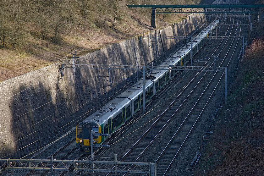 350251, LM 13.34 London Euston-Birmingham New Street (2Y26), Roade cutting 
 Withe sun too low in the afternoon sky to illuminate the bottom of Roade cutting 350251, with another unit, passes through in shadow working the 13.34 Euston to Birmingham New Street. 
 Keywords: 350251 LM 13.34 London Euston-Birmingham New Street 2Y26 Roade cutting London Midland Desiro