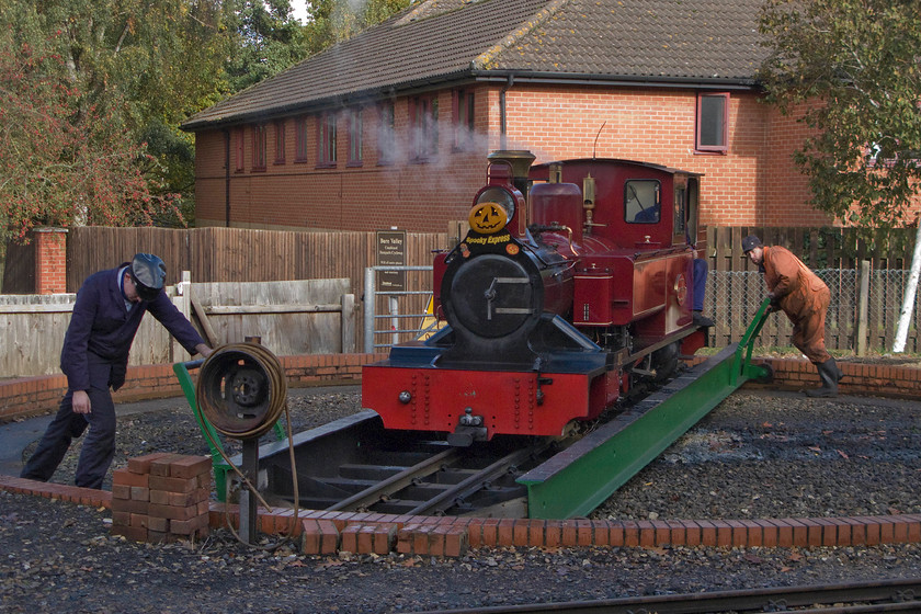 9, being turned, Aylsham station 
 Number 9 'Mark Timothy' is privately owned but sees regular service on the Bure Valley Railway that runs from Aylsham to Wroxham. Here it is seen being turned ready to operate the 12.40 departure to Wroxham. The locomotive is a pretty diminutive 15" gauge and was originally built as an oil burner in 1999 being converted to coal after a complete rebuild very early in its life. It has now gone on to be the line's mot economical performer in terms of its consumption of coal. 
 Keywords: 9 being turned Aylsham station Bure Valley Railway Mark Timothy