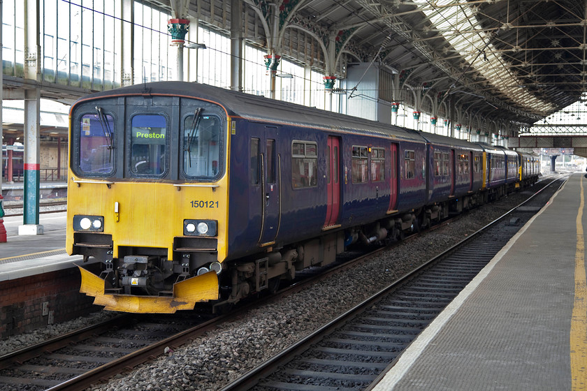 150121, 142004, NT 14.24 Preston-Hazel Grove (2H04, 2L), Preston station 
 Carefull observation of 150121 reveals that it has no branding. It has just been cascaded from the south west to become a Northern unit. Indeed, the last time I saw this particular unit it was running last summer on the St. Ives branch in Cornwall, see..... https://www.ontheupfast.com/v/photos/21936chg/24717820404/x150121-150106-2a07-carbis-bay. Here it is attached to 142004 forming the 14.24 Preston to Hazel Grove. 
 Keywords: 150121 142004 2H04 Preston station