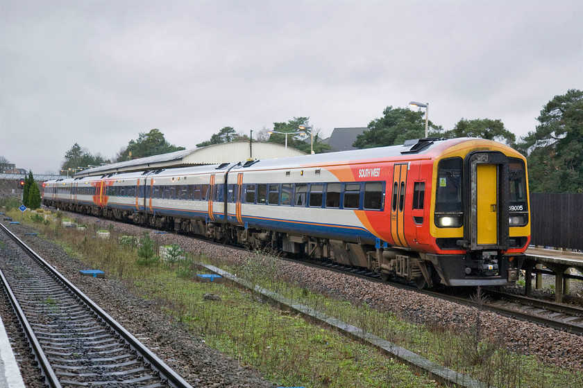 159005 & 159011, SW 10.25 Exeter St. David's-London Waterloo (1L40), Andover station 
 South West's 159005 and 159011pause at Andover station working the 10.25 Exeter St. David's to Waterloo service. In common with many station rationalisation over the years has reduced the size of the station with, for example, the removal of the twin centre through roads. 
 Keywords: 159005 159011 SW 10.25 Exeter St. David's-London Waterloo 1L40 Andover station South West Trains