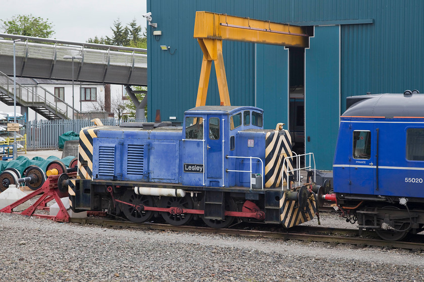 121020 & ex. 01509, stabled, Aylesbury Depot 
 Ruston & Hornsby built 01509 'Lesley' sits stabled at Chiltern's Aylesbury Depot. It looks a little in need of some attention with rather faded paintwork, but that's often how workhorses get treated. Bubble car 121020 sits in front of the shunter. 
 Keywords: 121020 01509 stabled Aylesbury Depot